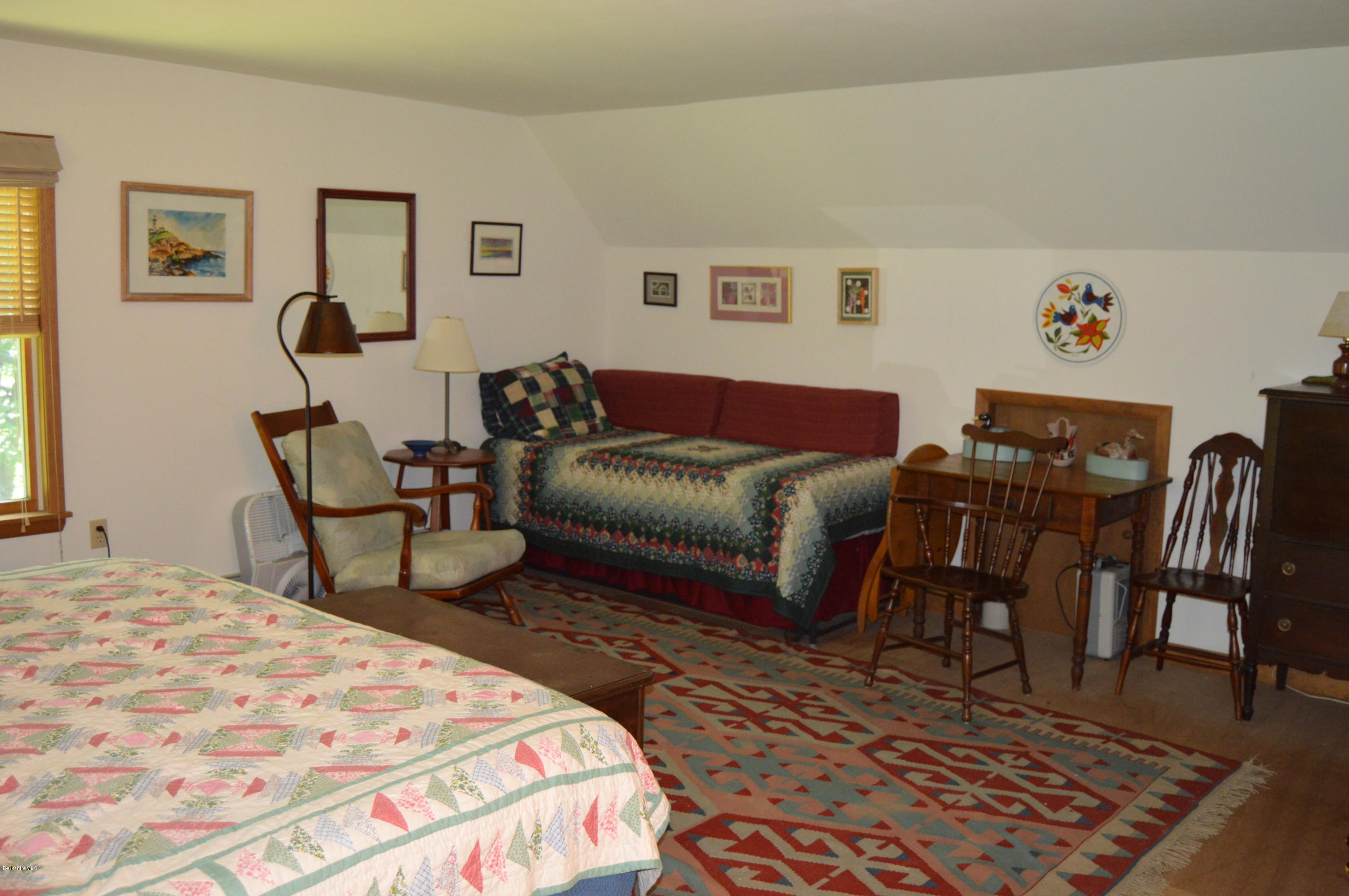 2965 Hancock Road Hancock, MA 01267 - Photo 20 of 33 a bedroom with a bed and wooden floor