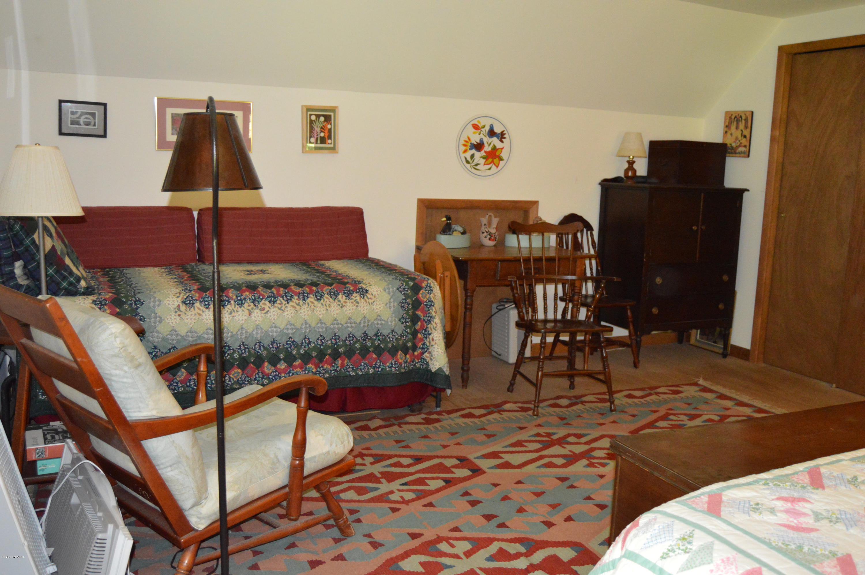 2965 Hancock Road Hancock, MA 01267 - Photo 21 of 33 a bedroom with a bed and wooden floor