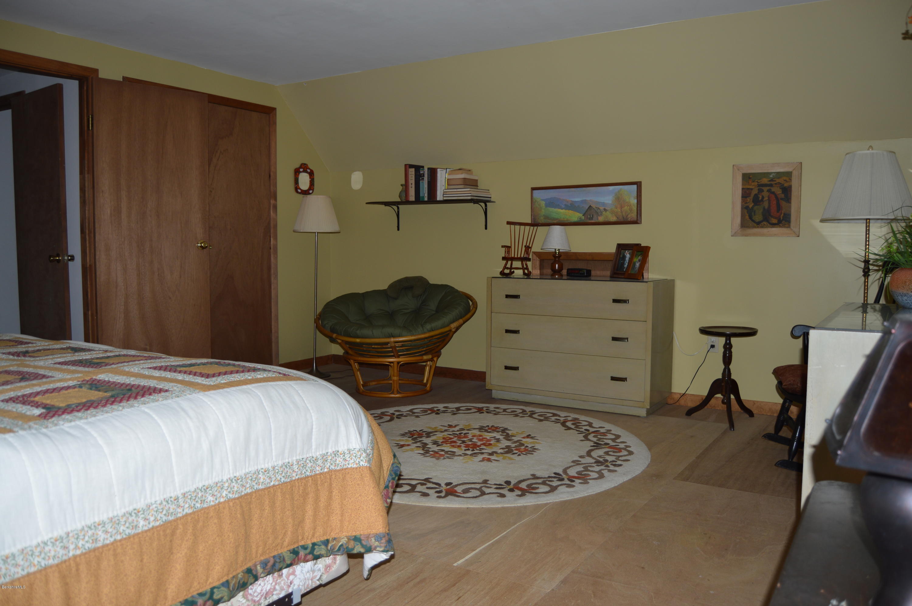2965 Hancock Road Hancock, MA 01267 - Photo 23 of 33 a bedroom with a bed and a chair in it