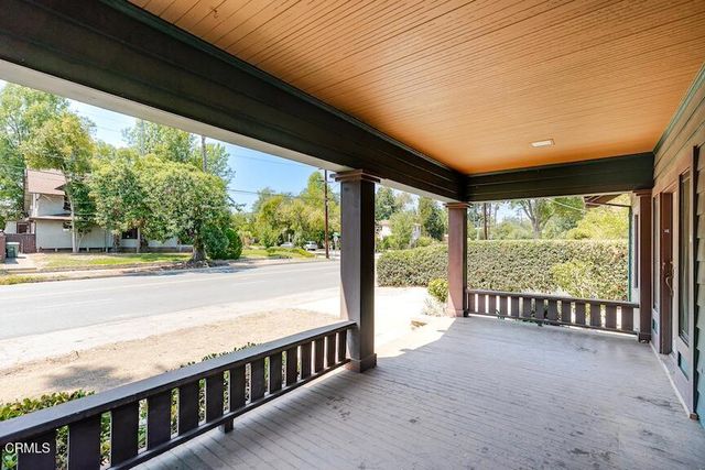 a view of a city street from a balcony