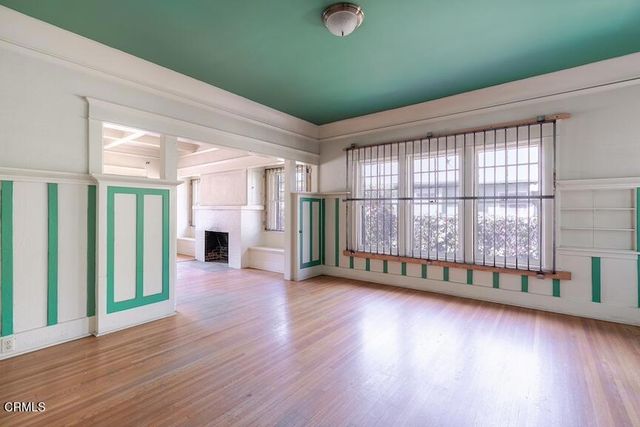 a view of a room with wooden floor