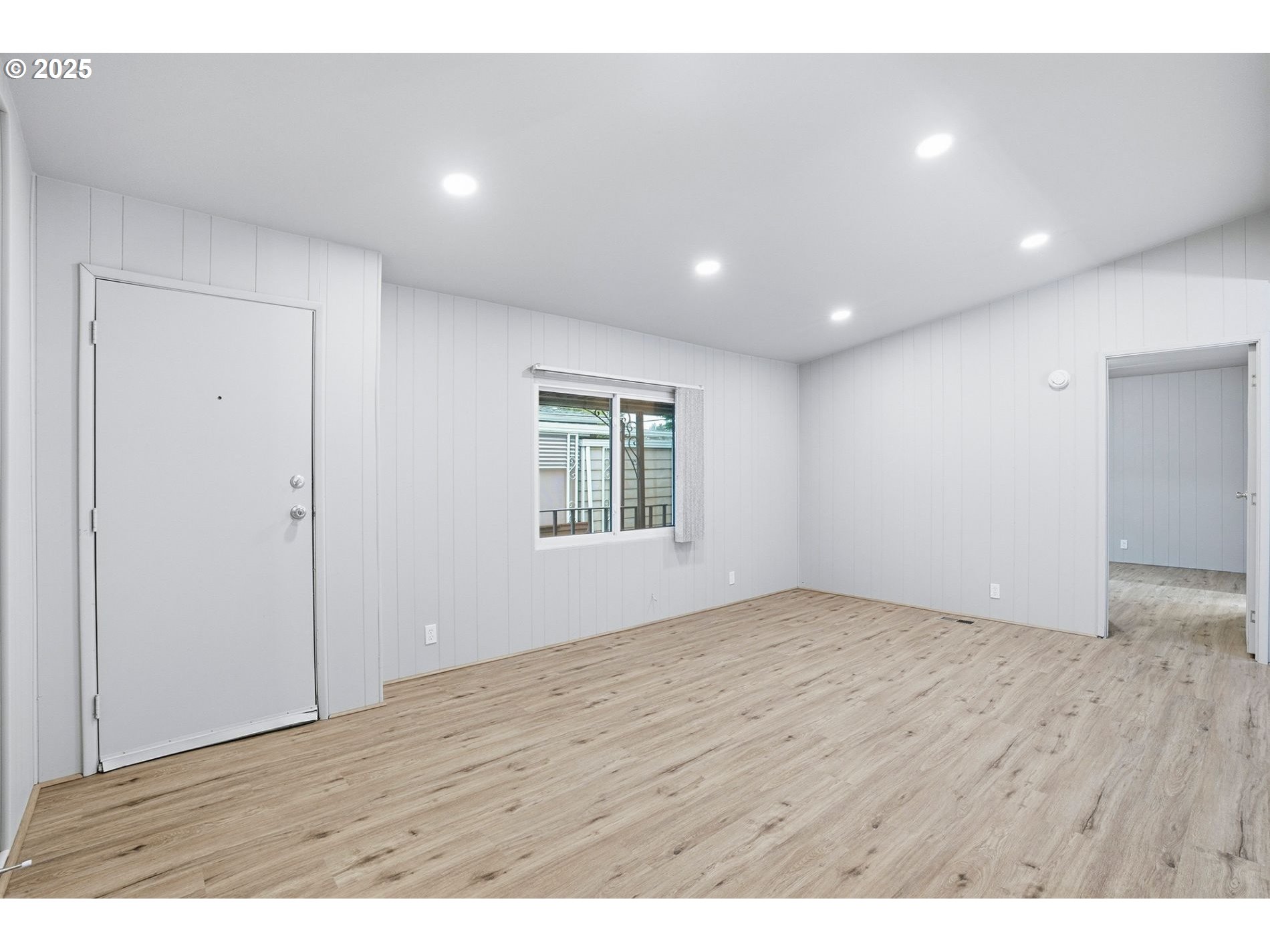 21100 Northeast Sandy Boulevard, Unit 59 Fairview, OR 97024 - Photo 15 of 16 an empty room with wooden floor and windows