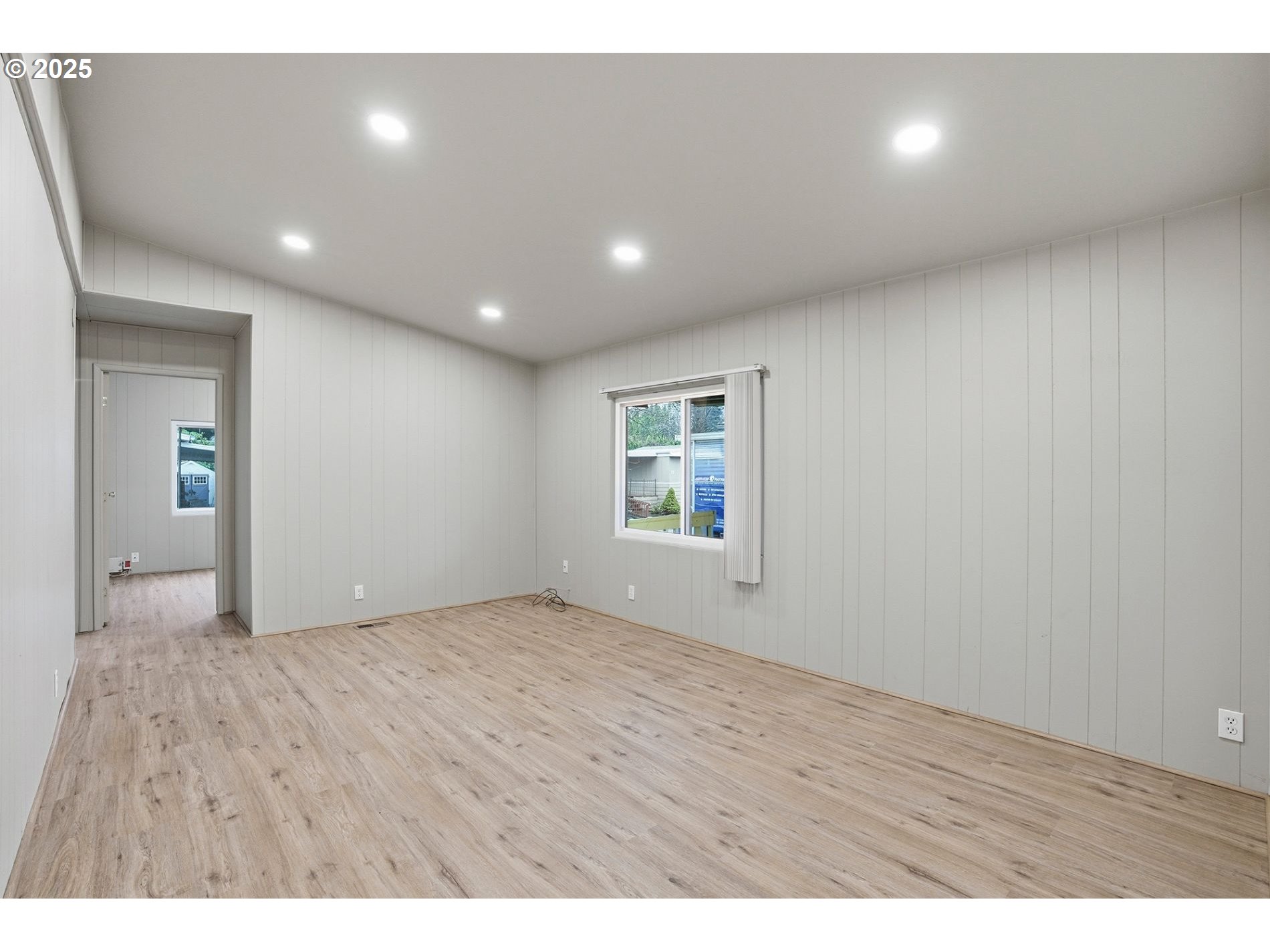 21100 Northeast Sandy Boulevard, Unit 59 Fairview, OR 97024 - Photo 16 of 16 a view of an empty room with wooden floor and a window