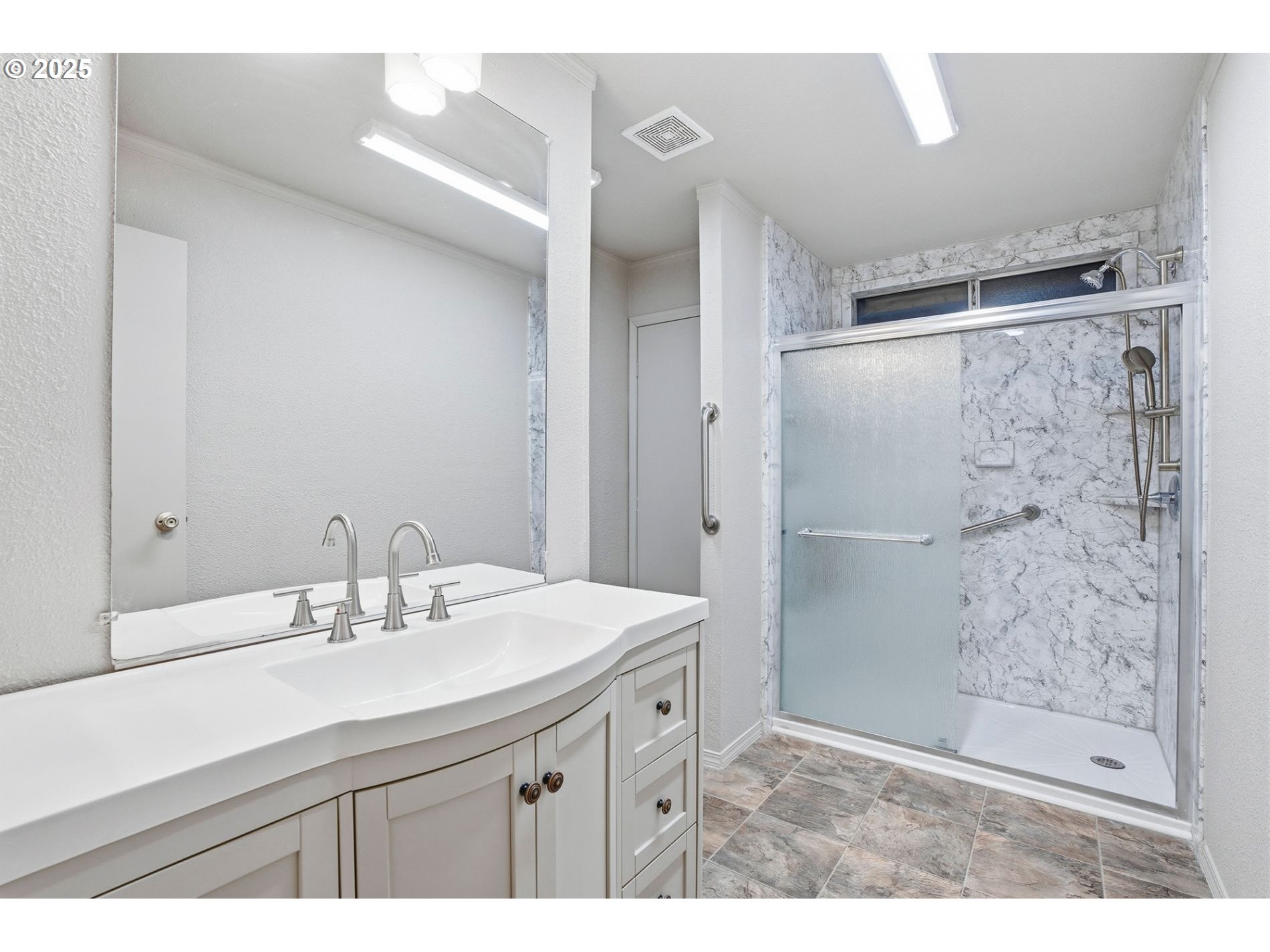 21100 Northeast Sandy Boulevard, Unit 59 Fairview, OR 97024 - Photo 4 of 16 a bathroom with a sink mirror and a shower