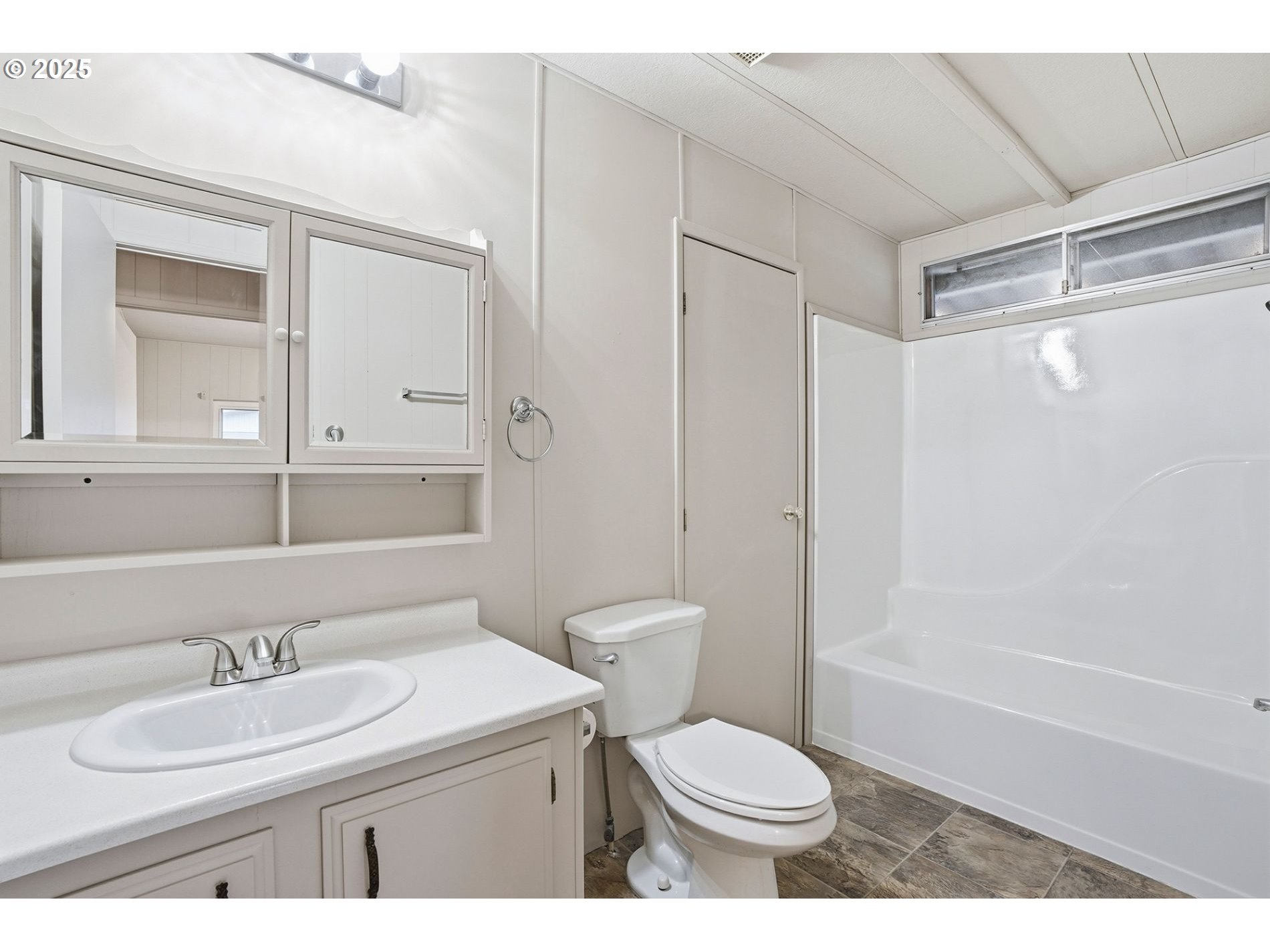 21100 Northeast Sandy Boulevard, Unit 59 Fairview, OR 97024 - Photo 7 of 16 a bathroom with a sink a toilet and shower