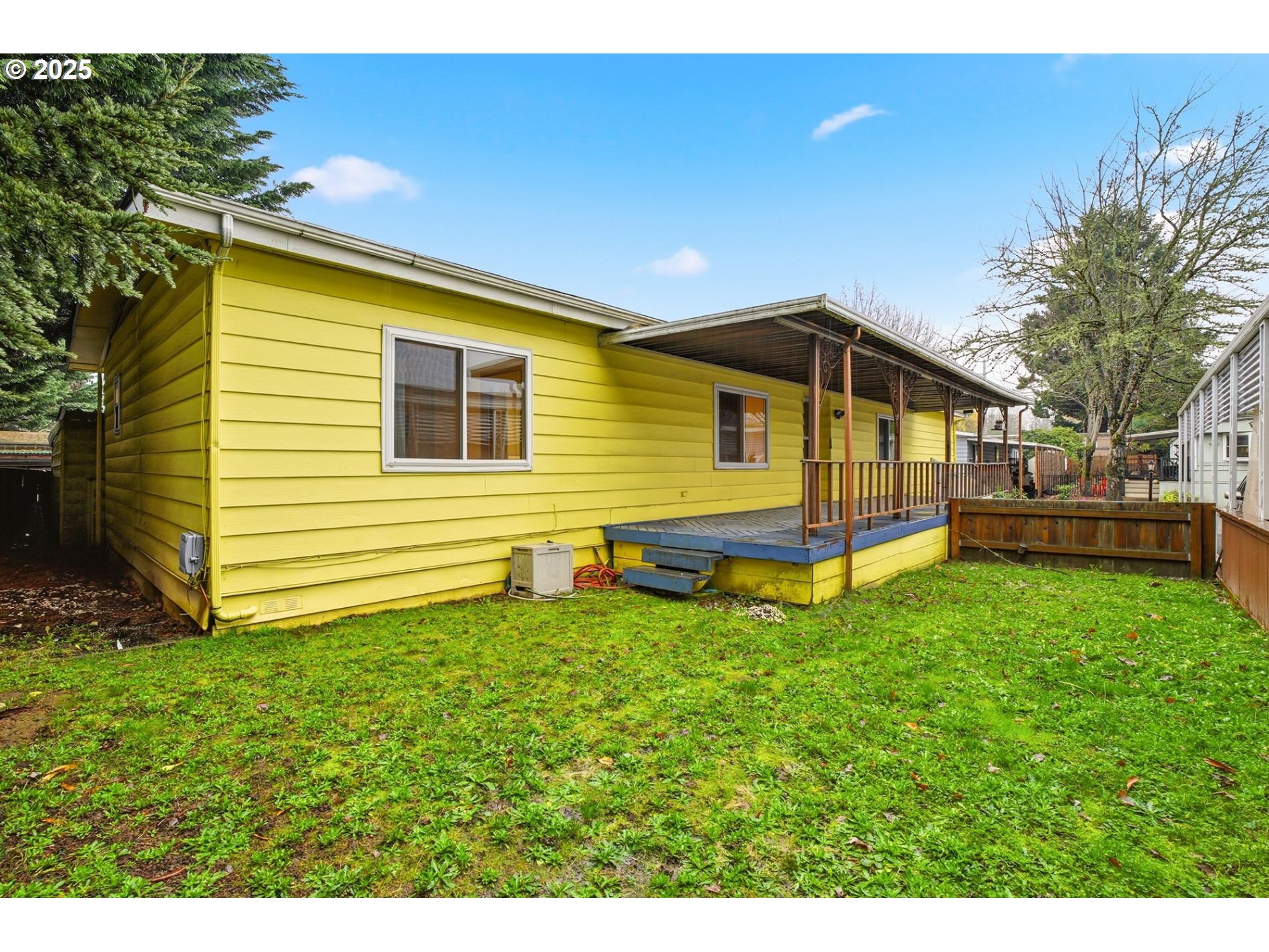 21100 Northeast Sandy Boulevard, Unit 59 Fairview, OR 97024 - Photo 8 of 16 a view of a backyard with a small cabin