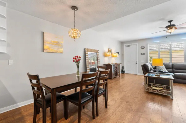 a kitchen with stainless steel appliances granite countertop white cabinets a sink and dishwasher