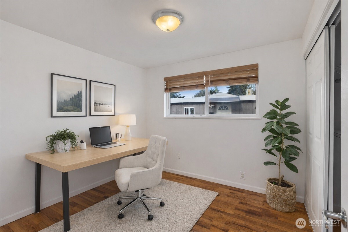 31368 13th Avenue South Federal Way, WA 98003 - Photo 11 of 36 a view of a workspace with furniture and wooden floor