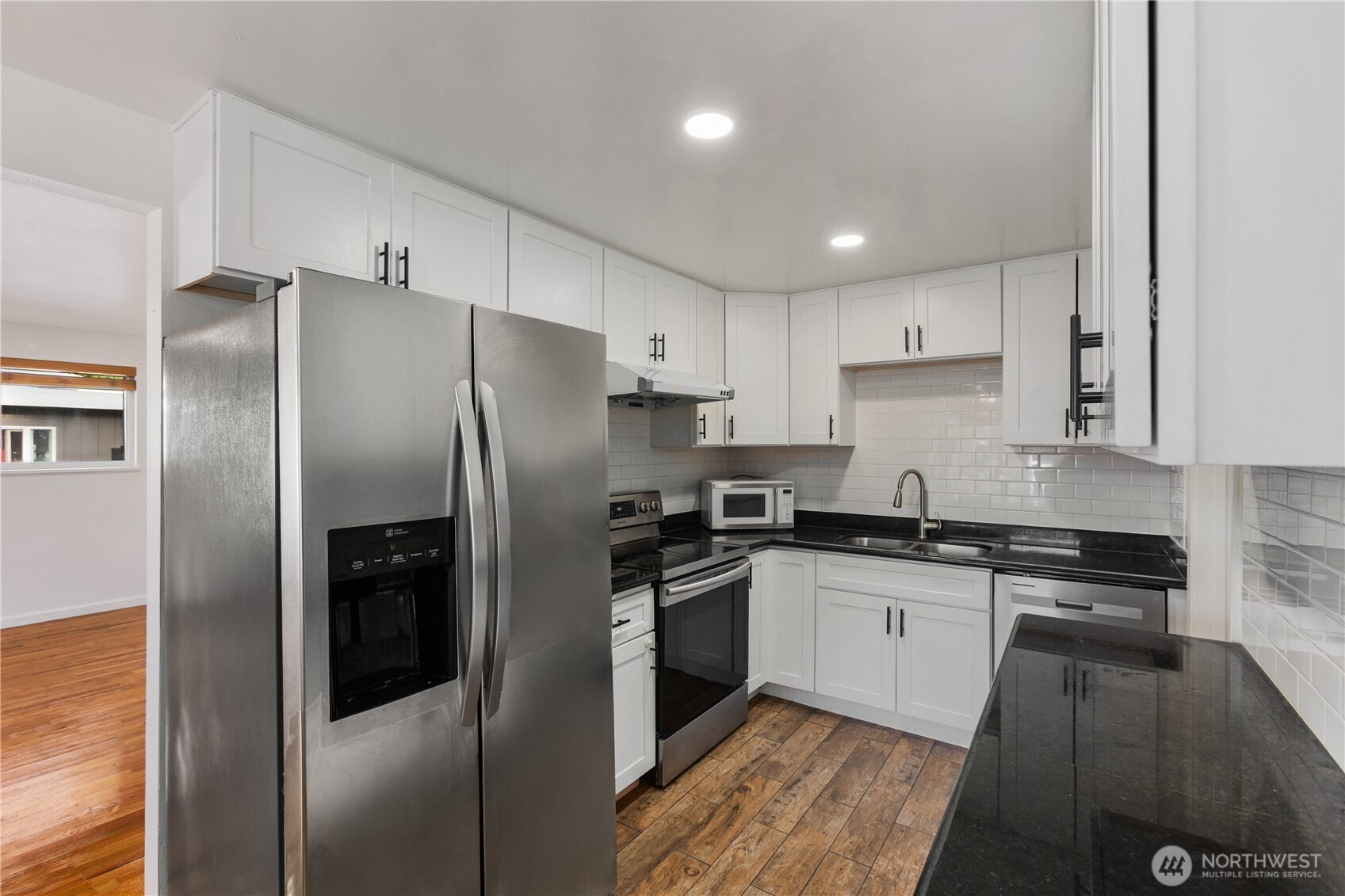 31368 13th Avenue South Federal Way, WA 98003 - Photo 19 of 36 a kitchen with granite countertop a refrigerator and a sink