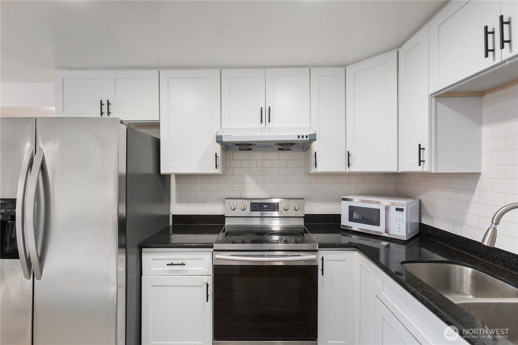 31368 13th Avenue South Federal Way, WA 98003 - Photo 22 of 36 a kitchen with stainless steel appliances granite countertop a sink stove and refrigerator