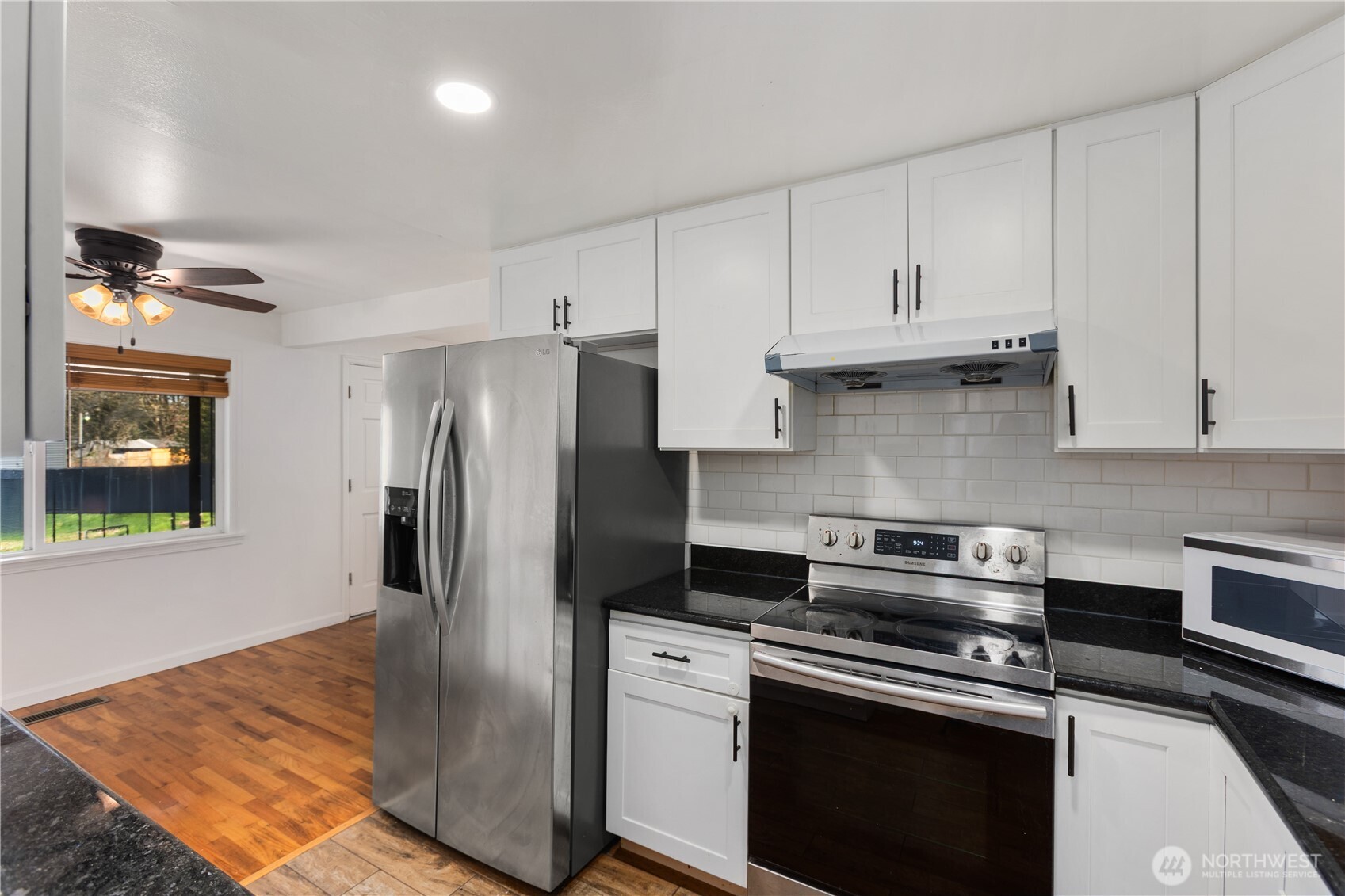 31368 13th Avenue South Federal Way, WA 98003 - Photo 23 of 36 a kitchen with stainless steel appliances granite countertop a refrigerator a stove and a sink