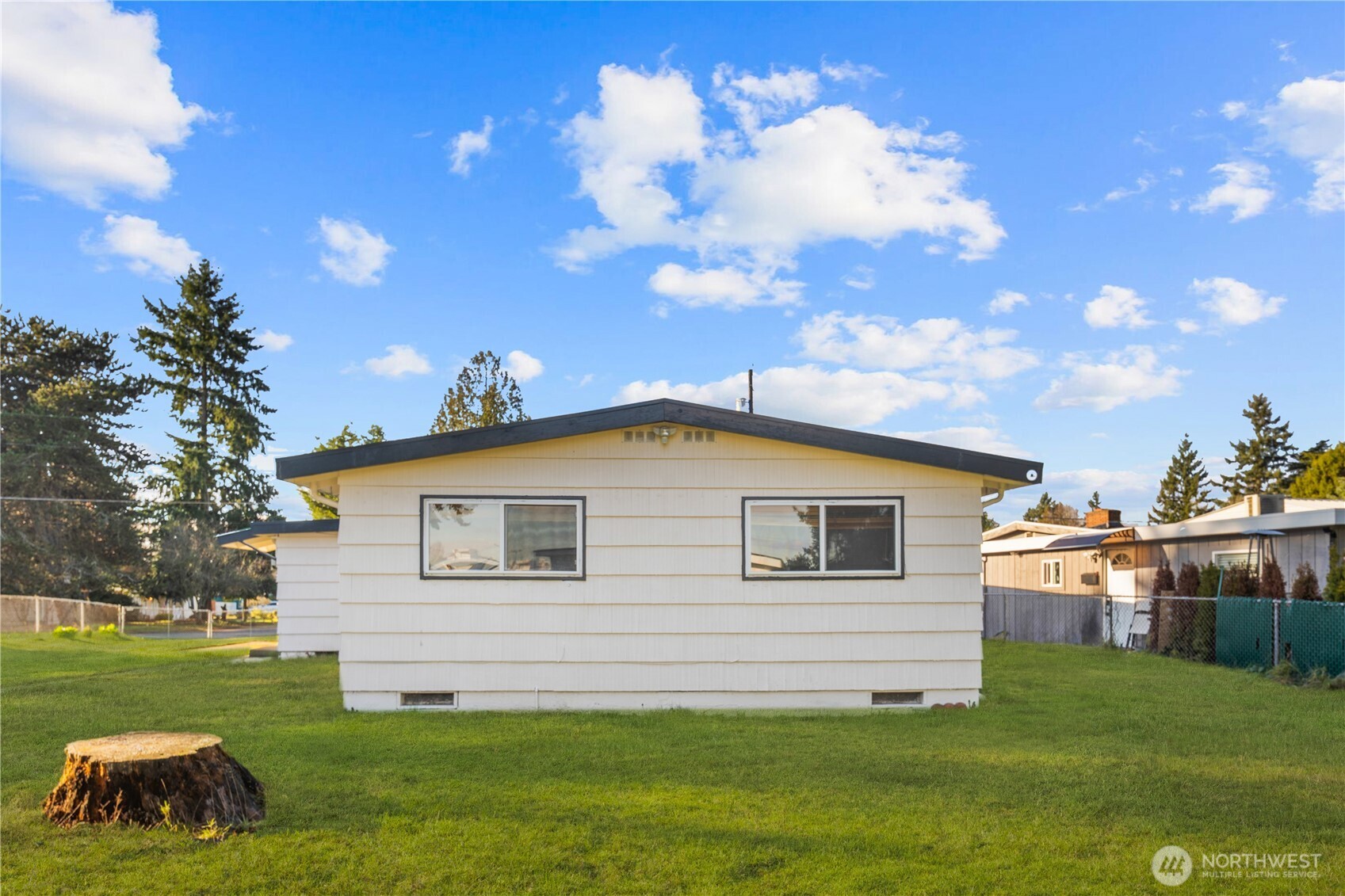 31368 13th Avenue South Federal Way, WA 98003 - Photo 32 of 36 a backyard of a house with table and chairs