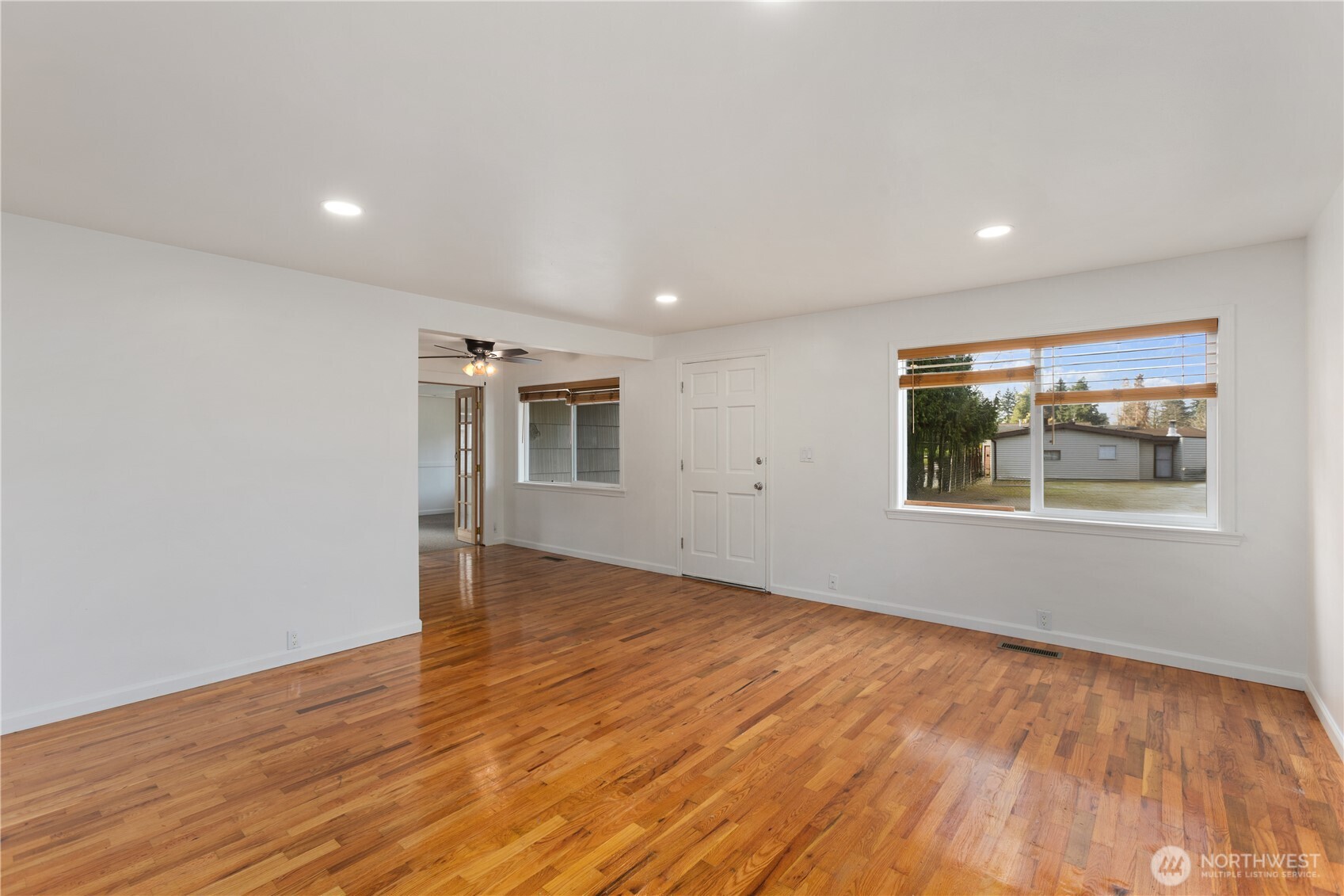31368 13th Avenue South Federal Way, WA 98003 - Photo 9 of 36 a view of an empty room with wooden floor and a window