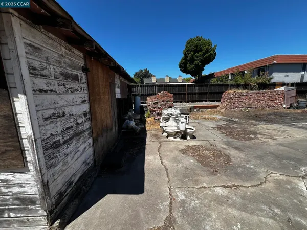 a view of an empty room with windows