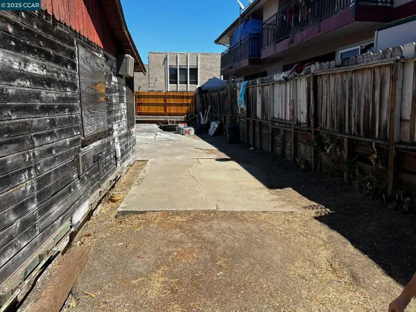 a view of path along with house and car parked