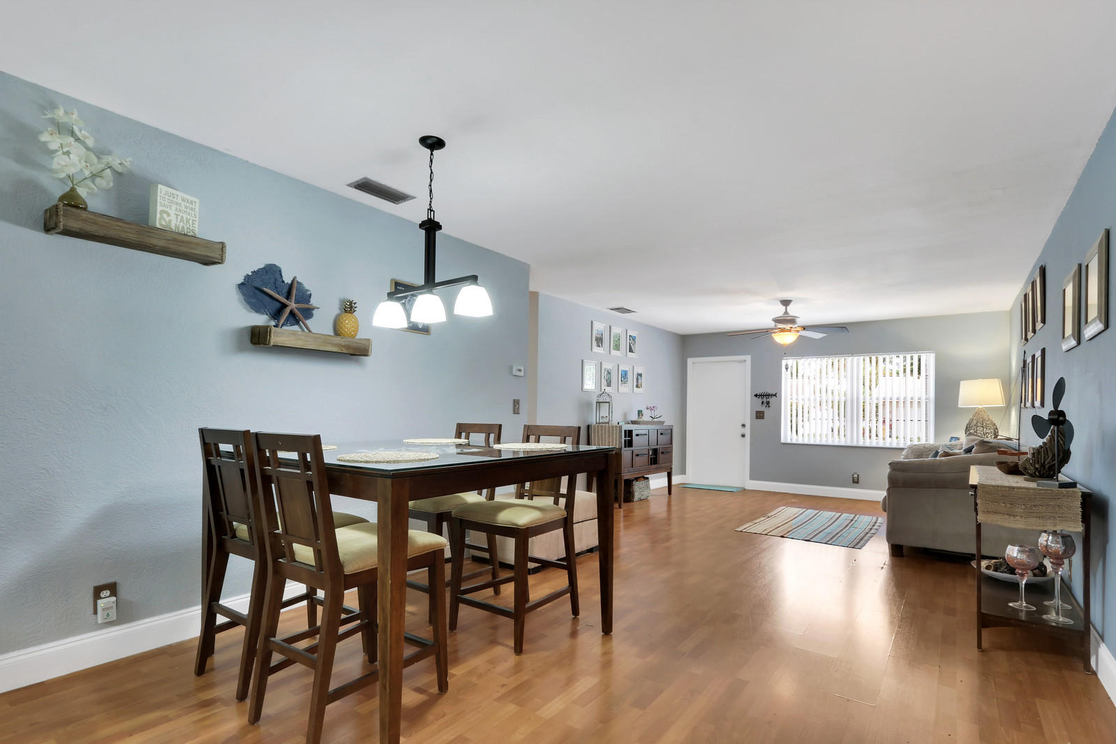 19501 Carolina Circle Boca Raton, FL 33434 - Photo 11 of 19 a view of a dining room with furniture wooden floor and chandelier