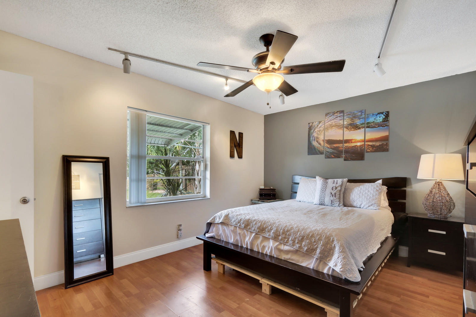 19501 Carolina Circle Boca Raton, FL 33434 - Photo 15 of 19 a bedroom with a large bed and a window