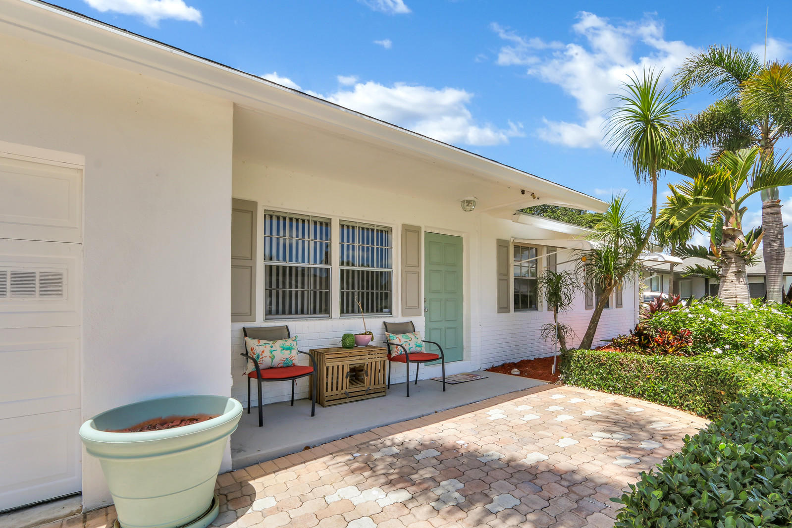 19501 Carolina Circle Boca Raton, FL 33434 - Photo 2 of 19 a building outdoor space with patio furniture and potted plants