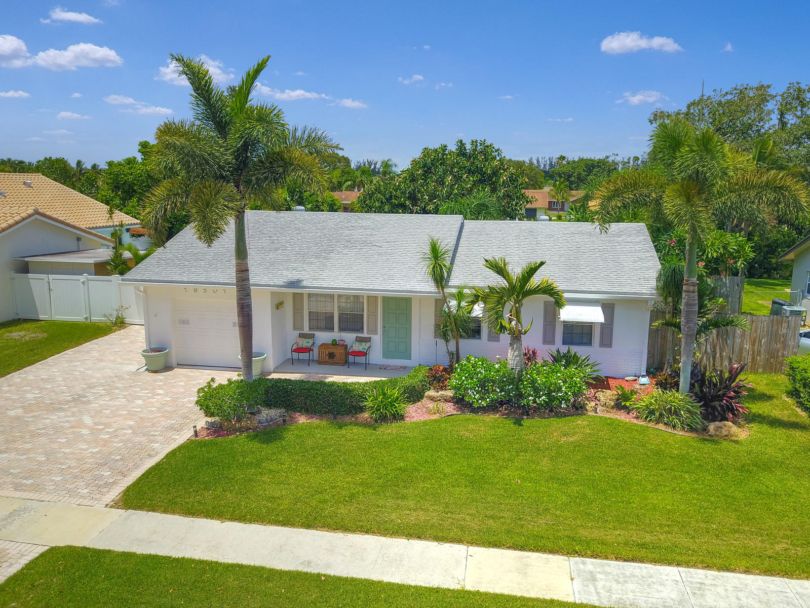19501 Carolina Circle Boca Raton, FL 33434 - Photo 4 of 19 front view of house with a yard
