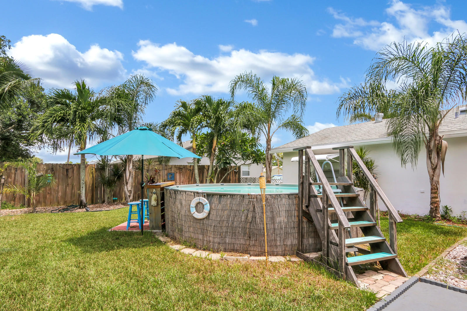 19501 Carolina Circle Boca Raton, FL 33434 - Photo 8 of 19 a view of a backyard with potted plants