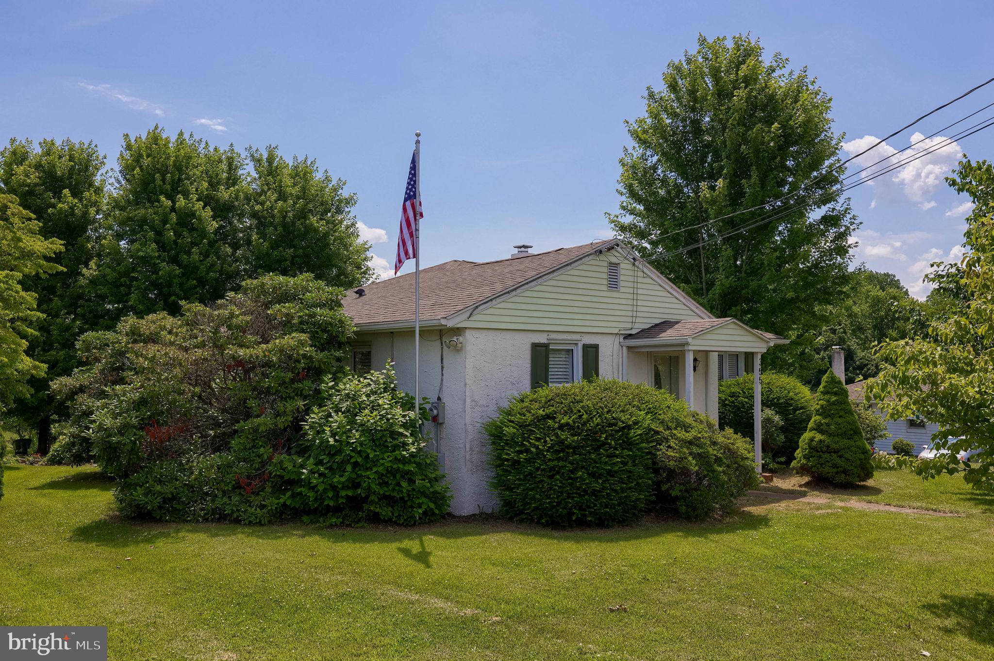 355 Harry Road Coatesville, PA 19320 - Photo 3 of 48 Charming home with lush greenery.