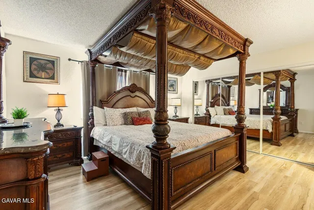 a bed room with a bed and a table
