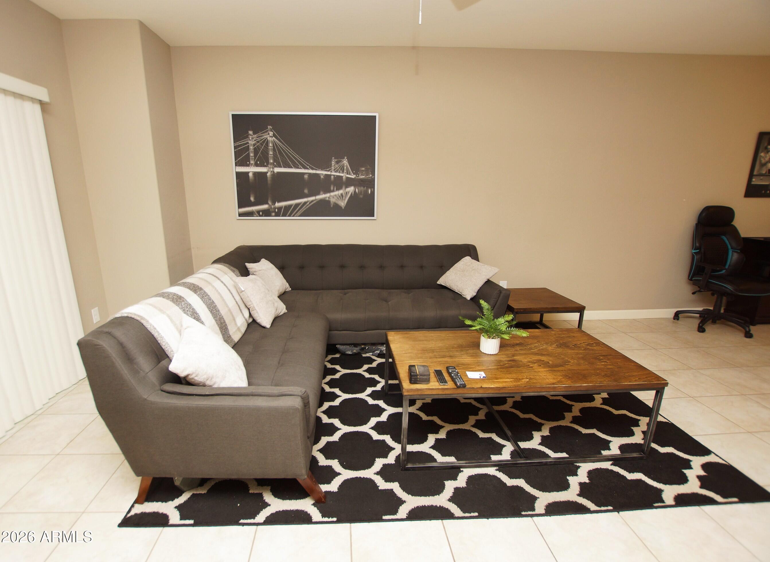 2150 West Alameda Road, Unit 1095 Phoenix, AZ 85085 - Photo 12 of 32 a living room with furniture and a rug
