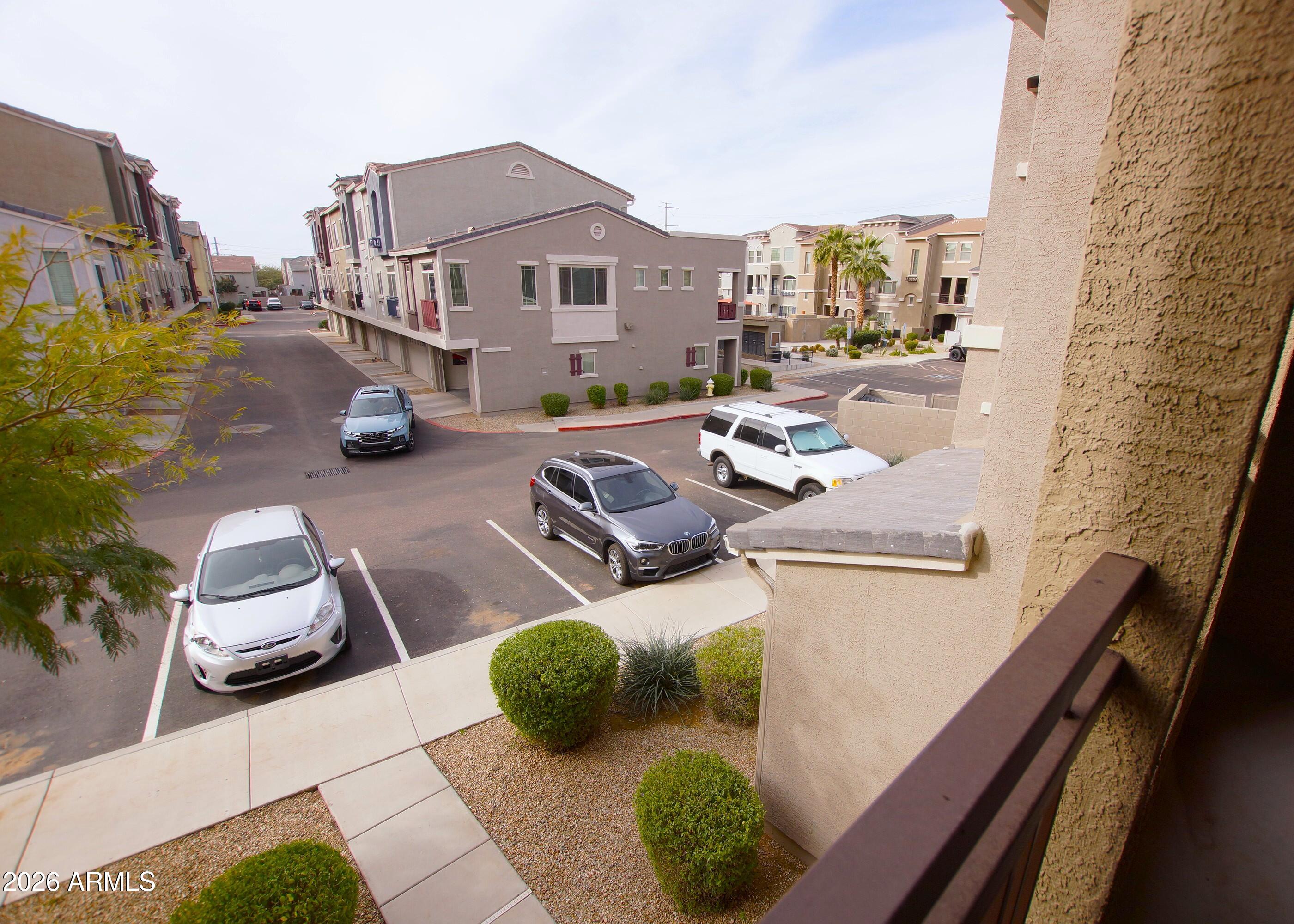 2150 West Alameda Road, Unit 1095 Phoenix, AZ 85085 - Photo 15 of 32 a view of a patio in back of a building