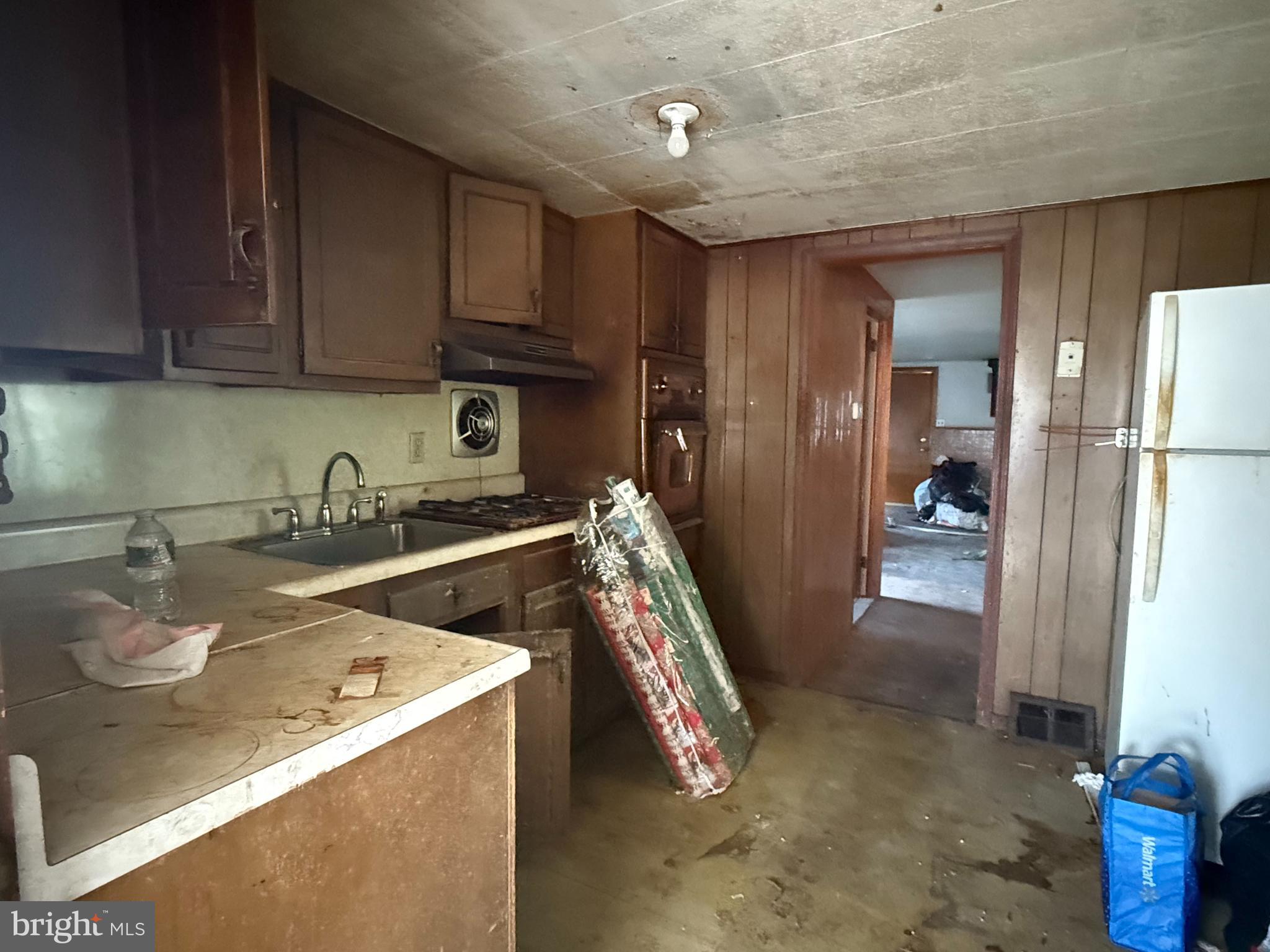 1557 Erial Road Clementon, NJ 08021 - Photo 6 of 20 a kitchen with a sink and a refrigerator
