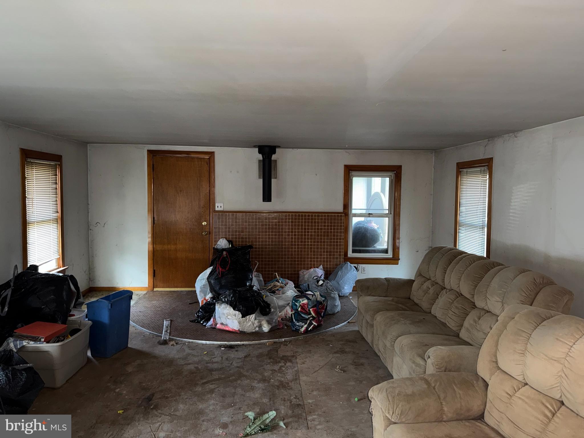 1557 Erial Road Clementon, NJ 08021 - Photo 10 of 20 a living room with furniture gym equipment and a window