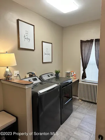 a kitchen with stainless steel appliances a sink stove and cabinets