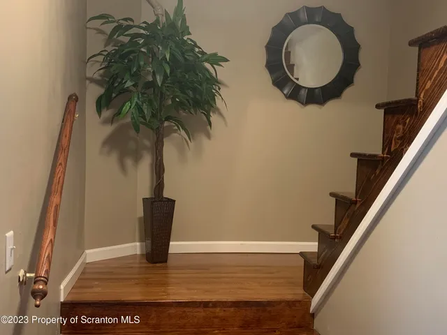 a view of entryway with wooden floor