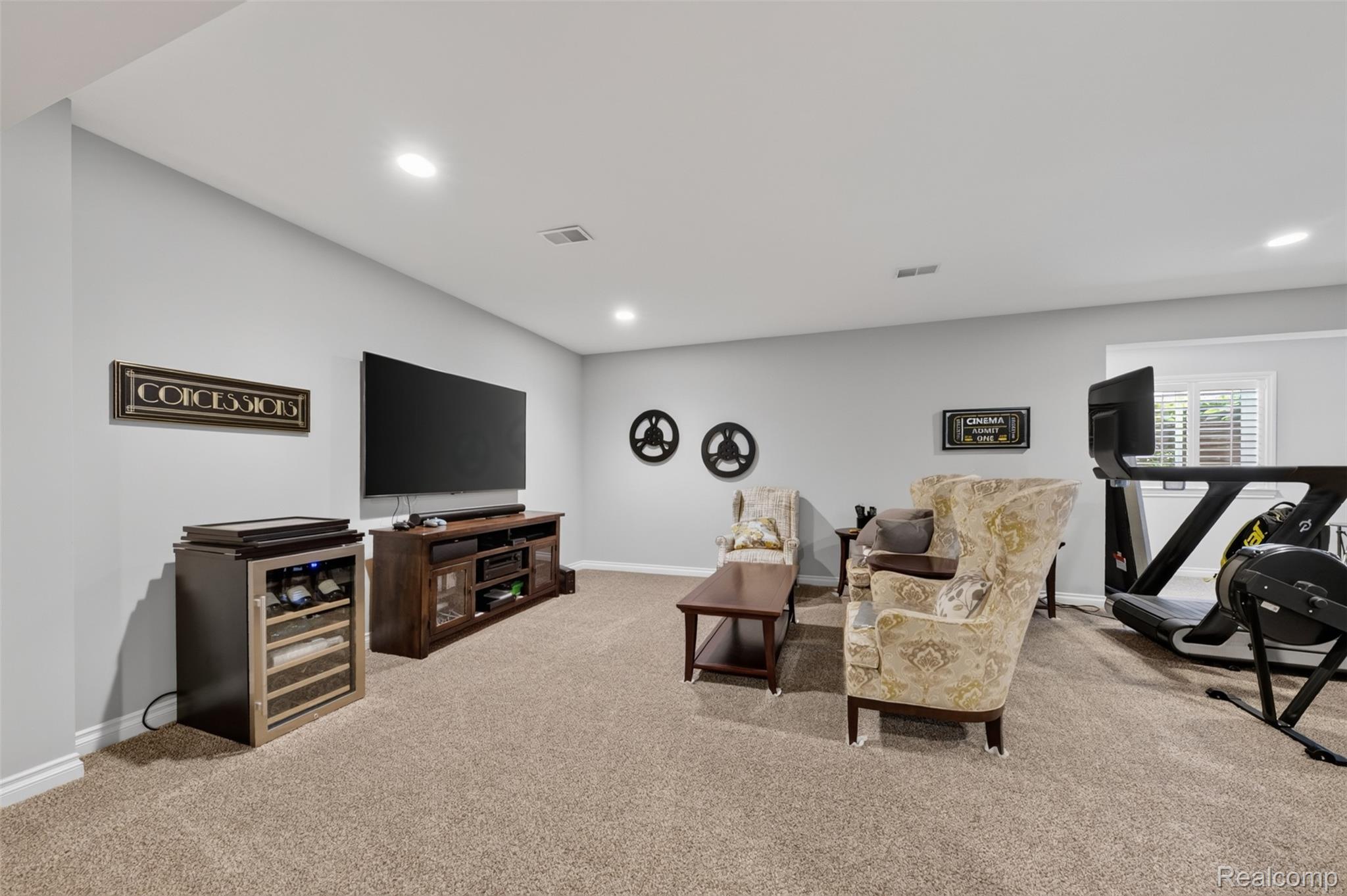 2531 Walnut View Drive Howell, MI 48855 - Photo 24 of 34 Spacious room featuring light gray walls, recessed lighting, and a neutral carpeted floor