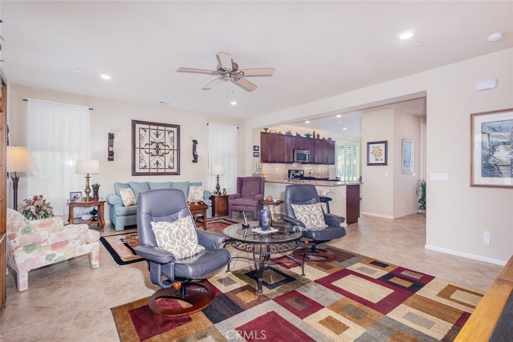 1370 Corte Alamonte Hemet, CA 92545 - Photo 13 of 62 a living room with furniture and a rug