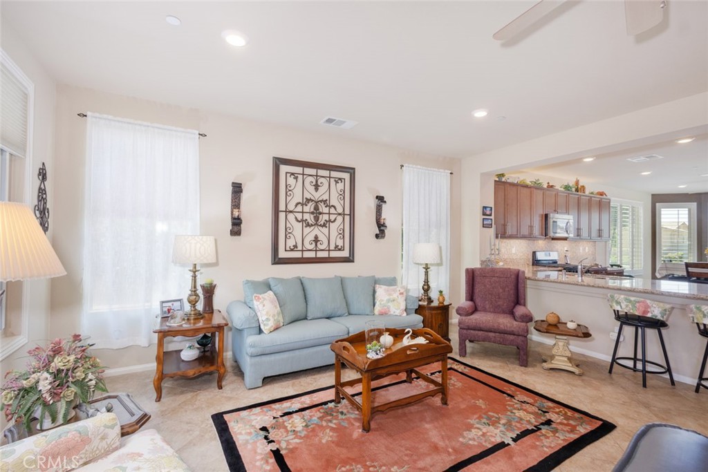 1370 Corte Alamonte Hemet, CA 92545 - Photo 14 of 62 a living room with furniture a rug and a window