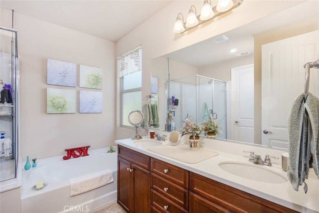 1370 Corte Alamonte Hemet, CA 92545 - Photo 18 of 62 a bathroom with a sink double vanity and a tub