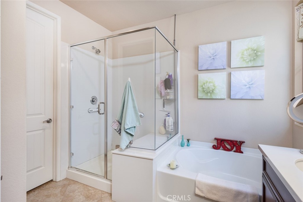 1370 Corte Alamonte Hemet, CA 92545 - Photo 19 of 62 a bathroom with a sink and a shower