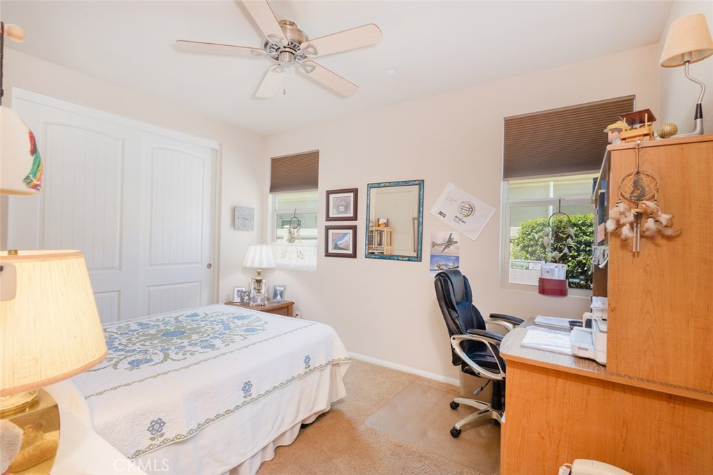 1370 Corte Alamonte Hemet, CA 92545 - Photo 20 of 62 a bedroom that has a bed and a chair in it