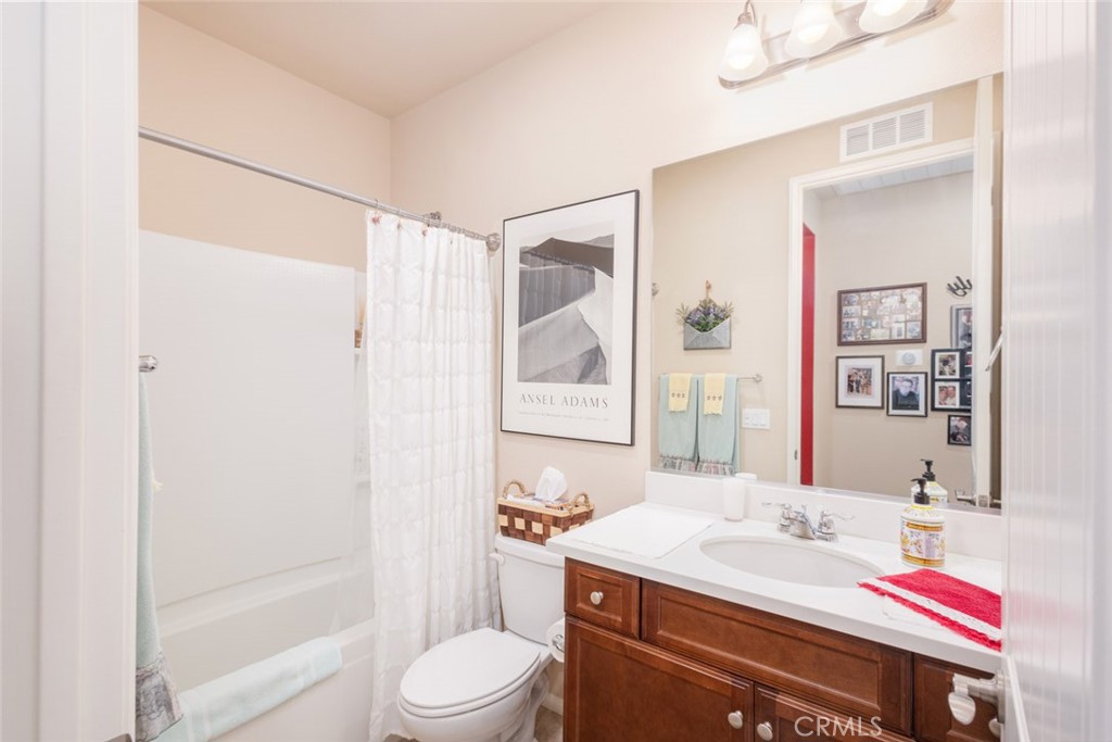 1370 Corte Alamonte Hemet, CA 92545 - Photo 21 of 62 a bathroom with a sink a toilet and shower