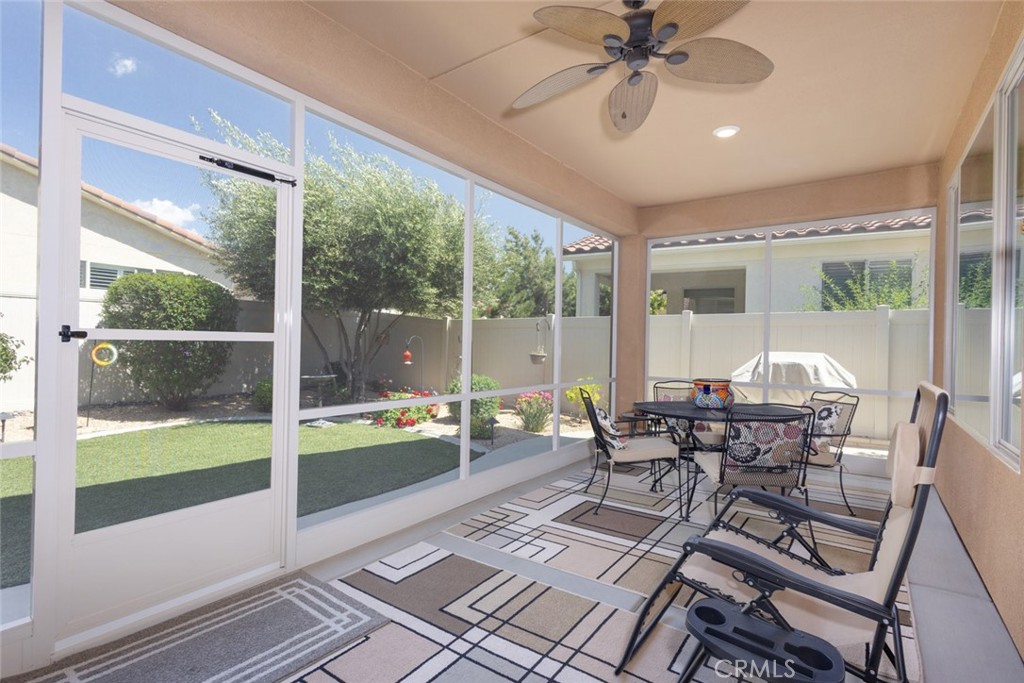 1370 Corte Alamonte Hemet, CA 92545 - Photo 23 of 62 a dining room with furniture water view and a floor to ceiling window