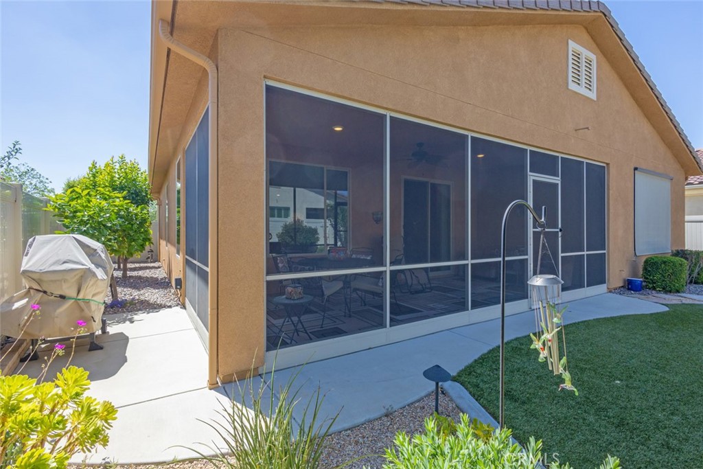 1370 Corte Alamonte Hemet, CA 92545 - Photo 28 of 62 a view of backyard with outdoor seating and plants