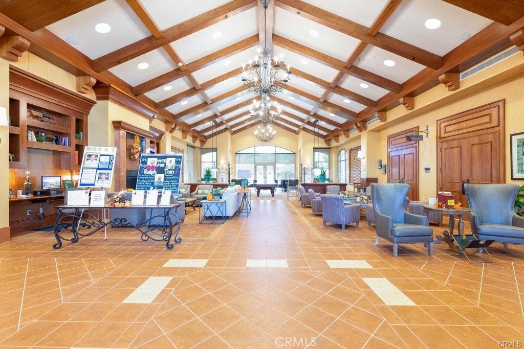 1370 Corte Alamonte Hemet, CA 92545 - Photo 32 of 62 a living room with lots of furniture and a chandelier