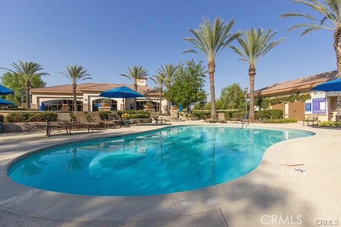 1370 Corte Alamonte Hemet, CA 92545 - Photo 55 of 62 a view of a swimming pool with a garden and plants