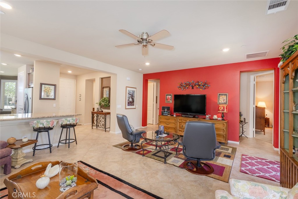 1370 Corte Alamonte Hemet, CA 92545 - Photo 8 of 62 a living room with furniture and a flat screen tv