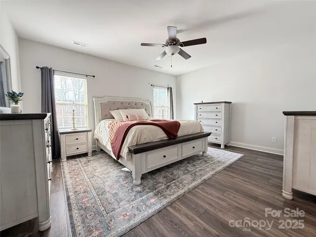 a bed room with a bed and a chandelier