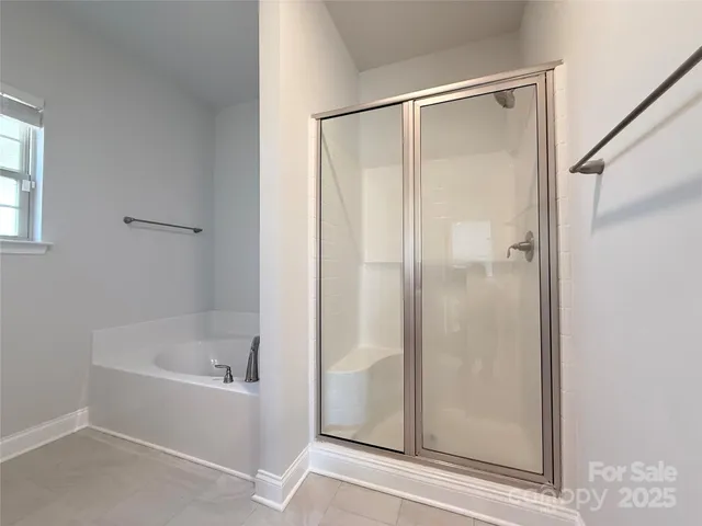 a white bath tub sitting next to a white sink