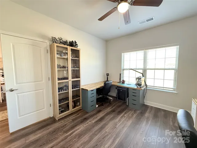 a view of a livingroom with furniture and a window