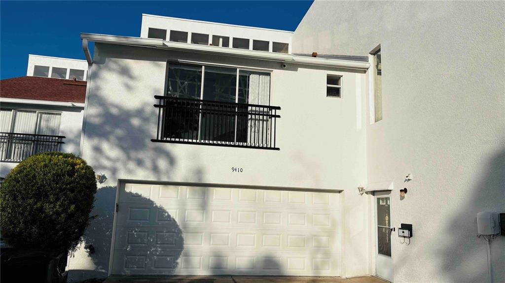 a front view of a house with a glass door