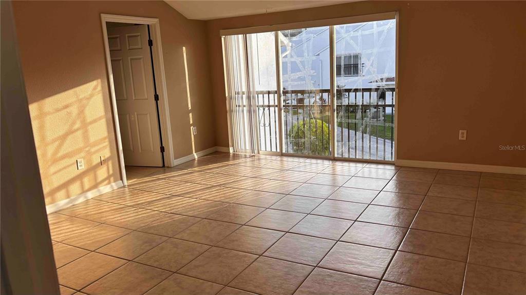 9410 Citrus Glen Place Tampa, FL 33618 - Photo 12 of 30 a view of a livingroom with a floor to ceiling window and an entryway