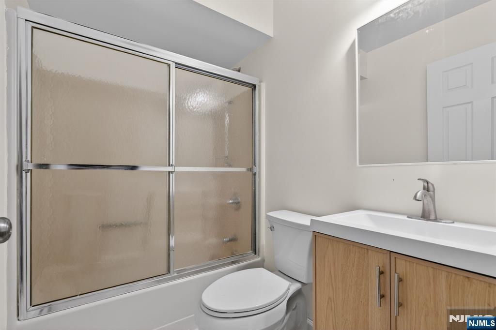 7 Hopson Avenue, Unit B Little Falls, NJ 07424 - Photo 19 of 24 a bathroom with a sink toilet and shower
